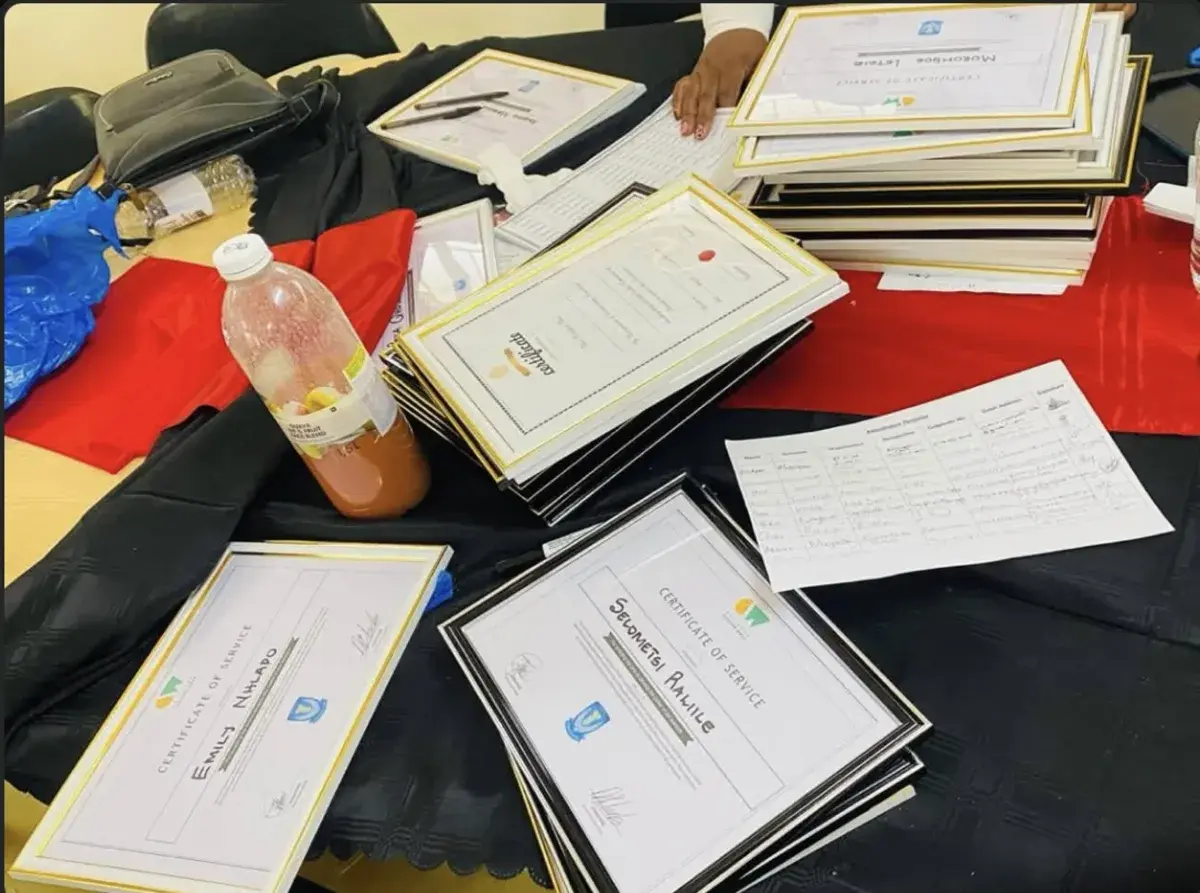 Framed certificates of service laid out on a table