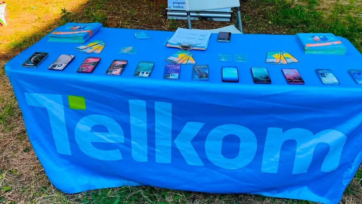 A Telkom-branded table displaying mobile devices